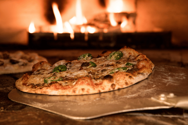 Totino's Pizza Air Fryer Style - Perfectly Crispy and Easy 4 A freshly baked pizza, made in a traditional style, with a golden crust and rich toppings.