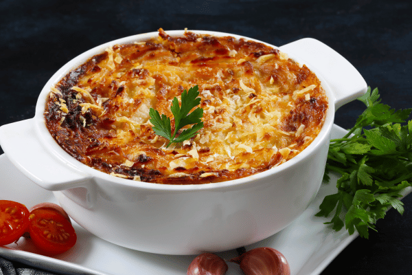 Keto Shepherd's Pie Recipe: Quick and Low-Carb Comfort Food 4 A white casserole dish holds a delicious cottage or shepherd's pie.