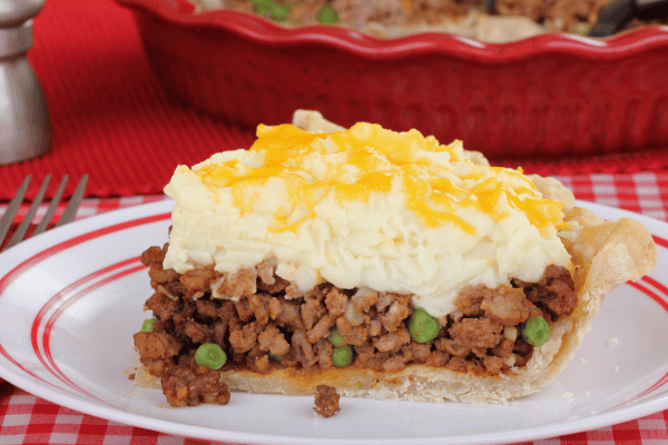 Keto Shepherd's Pie Recipe: Quick and Low-Carb Comfort Food 5 A slice of keto shepherd's pie sits on a plate, showing off its delicious layers.