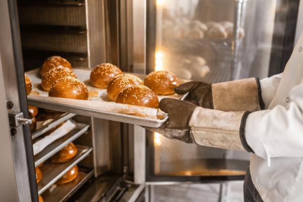 Carb Free Bread Recipe: A Simple Guide for Beginners 6
A person carefully removes freshly baked low-carb bread from the oven.