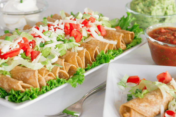 Jose Ole Taquitos Air Fryer: A Step-by-Step Cooking Tutorial 6 Jose Ole Taquitos Air Fryer: Beautifully arranged tray of taquitos with flavorful side dishes, ready to serve!