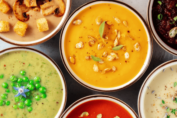 Keto Vegetable Soup: The Ultimate Low-Carb Option for Every Season 8 A top view of various bowls of soup, each showcasing a different type. One might have a vibrant vegetable medley, another a creamy tomato blend, and another with hearty chunks of meat.