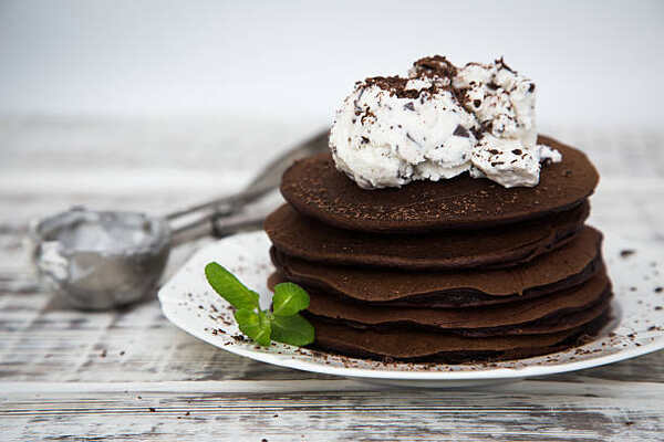 Fluffy Keto Pancakes: Low-Carb Breakfast You’ll Love 7 A stack of chocolate pancakes topped with whipped cream