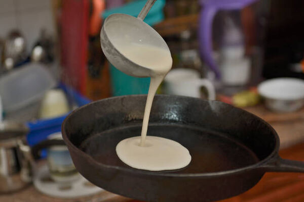 Fluffy Keto Pancakes: Low-Carb Breakfast You’ll Love 5 Pouring pancake batter into a pan