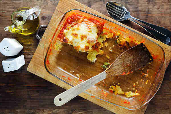 Easy Keto Lasagna: A Delicious Low-Carb Dinner Recipe 13 A slice of leftover lasagna in a baking dish
