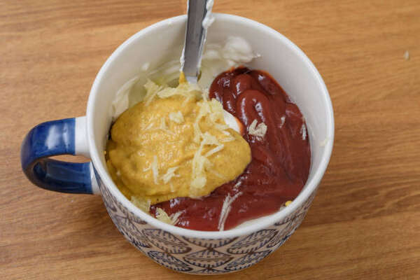 Keto Thousand Island Dressing Perfect for Low-Carb Salads 4 Mixing the ingredients for Thousand Island dressing in a bowl