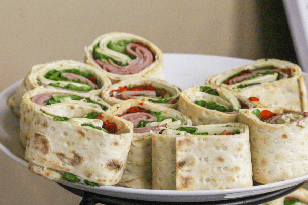 Easy Turkey Wrap Recipe for a Healthy Lunch in Minutes 2 A plate with beautifully cut turkey wraps, neatly arranged.