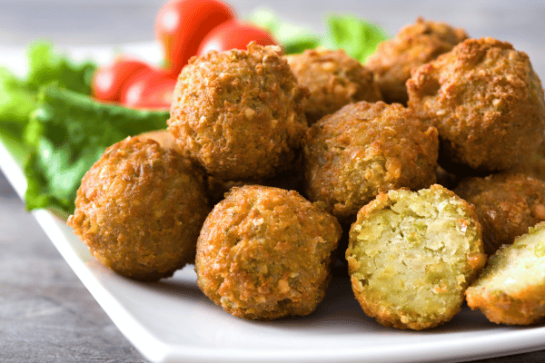 Is Falafel Keto Friendly? How to Make Low-Carb Versions 2 Crispy keto falafel on a plate, perfectly golden and full of flavor! A low-carb twist on the classic, served with fresh veggies.