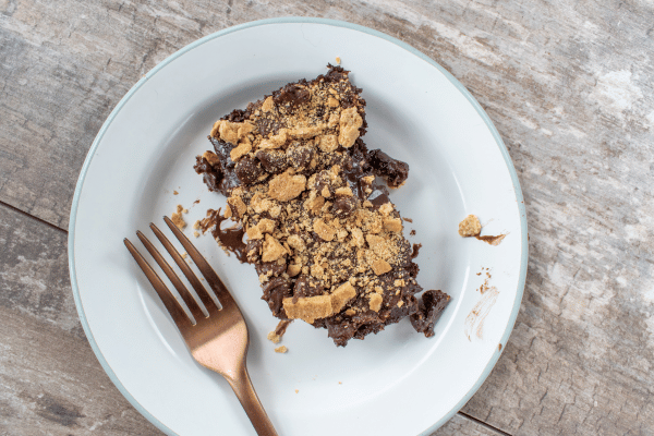 A plate of keto graham cracker bars, showcasing layers of crunchy graham cracker crust and creamy filling.