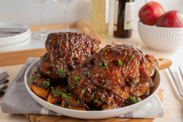 Easy Turkey Wrap Recipe for a Healthy Lunch in Minutes 7 A hearty Sunday or holiday meal featuring oven-roasted turkey shanks served on a plate with a variety of vegetables.