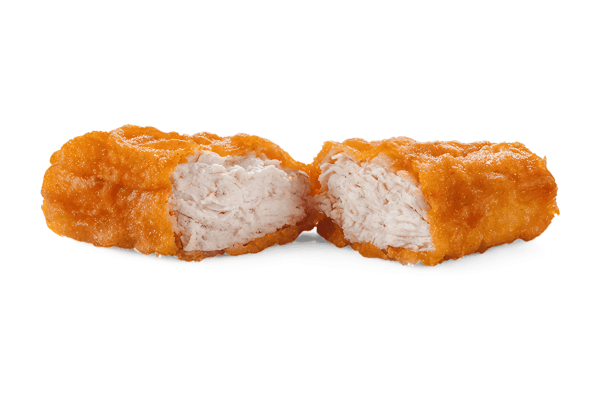 Chicken McNuggets Carbs: A Guide for Low-Carb Dieters 3 A crispy chicken nugget cut in half, revealing tender white meat inside, set against a plain white background.