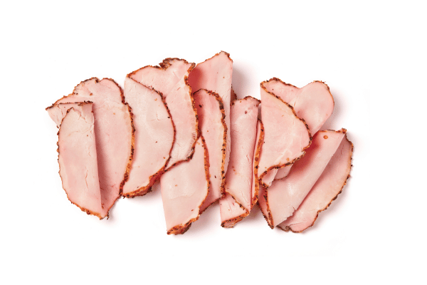 Easy Turkey Wrap Recipe for a Healthy Lunch in Minutes 4 Slices of turkey breast ham neatly layered on a clean white background.