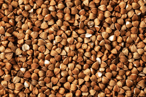 Is Buckwheat Keto Friendly? Everything You Need to Know 4 A close-up shot of buckwheat shows the small, triangular grains in great detail.