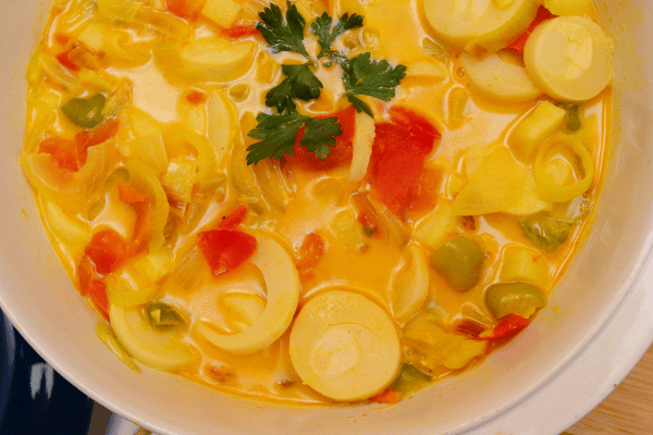 The Best Keto Pasta to Satisfy Your Carb Cravings 6 A top view of a vibrant bowl of palm pasta soup.