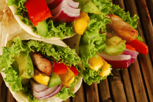 Easy Turkey Wrap Recipe for a Healthy Lunch in Minutes 6 Wrap sandwiches filled with fresh veggies, neatly rolled in soft tortillas.