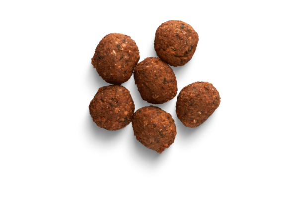 Is Falafel Keto Friendly? How to Make Low-Carb Versions 9 Crispy, golden-brown falafel resting on a clean white background, showcasing its crunchy texture and perfectly fried exterior.