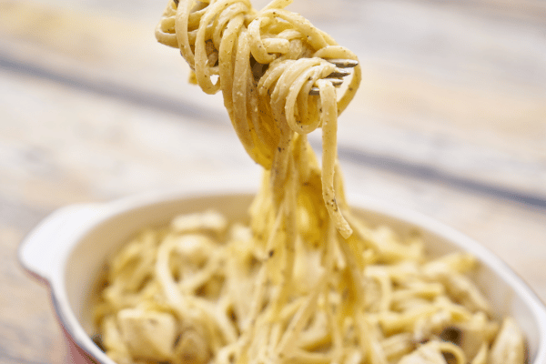 The Best Keto Pasta to Satisfy Your Carb Cravings 8 A fork twirls keto carbonara made with low carb noodles.