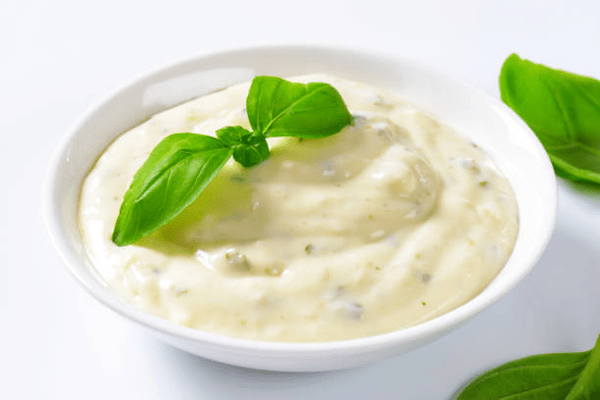 Is Hidden Valley Ranch Dressing Keto? What You Need to Know 4 Creamy ranch dressing with herbs in a dipping bowl