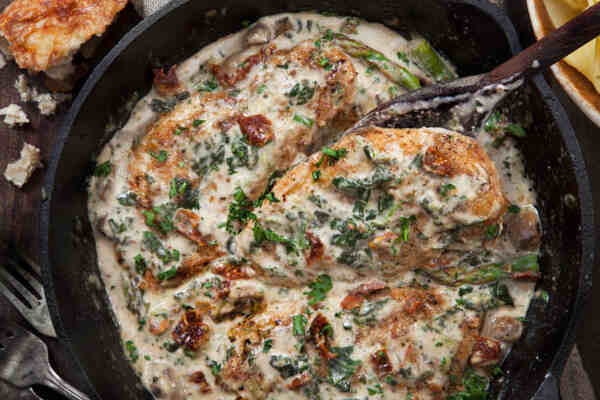 Easy Keto Meals That Make Low-Carb Living a Breeze 8 Creamy Tuscan chicken with herbs in a skillet