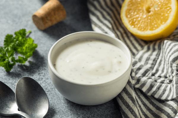 Is Hidden Valley Ranch Dressing Keto? What You Need to Know 6 Homemade ranch dressing in a bowl with a slice of lemon
