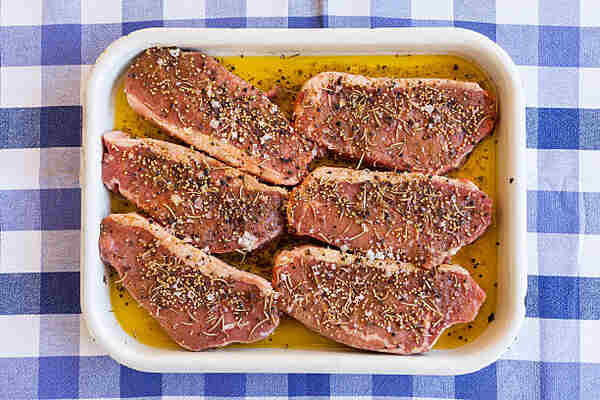 Flavorful Keto Steaks: Easy Recipes for Low-Carb Meals 9 Marinated keto steaks with oil, salt, pepper, and herbs