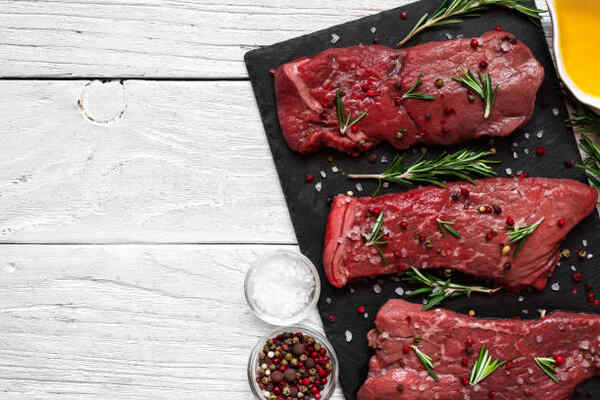 Keto Beef Stew Recipe: Low-Carb Comfort in a Bowl 5 Raw beef seasoned with salt, pepper, and herbs