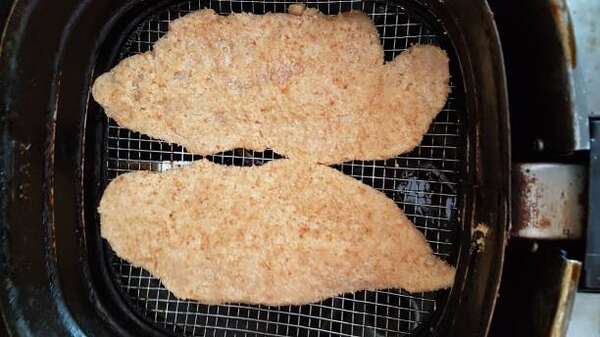 Quick and Easy Aldi Red Bag Chicken Air Fryer Recipe 4 Raw breaded chicken fillet in an air fryer
