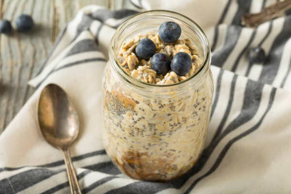 10 Delicious Keto Breakfast Without Eggs to Start Your Day 9 Overnight oats with chia seeds and blueberries in a glass jar
