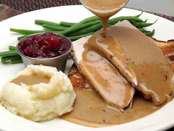 Easy Keto Turkey Gravy Perfect for Your Low-Carb Feast 9 Turkey gravy poured over roast turkey with mashed potato
