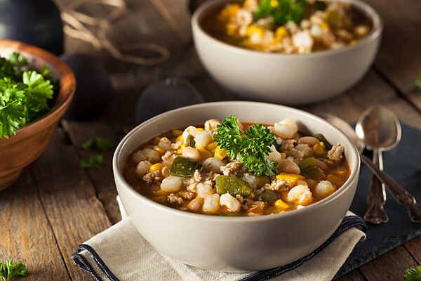 Easy Keto White Chicken Chili Recipe for Cozy Nights 3 Bowls of white bean chicken chili with herbs