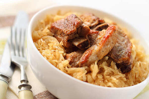 Baked pork ribs and sauerkraut in a bowl