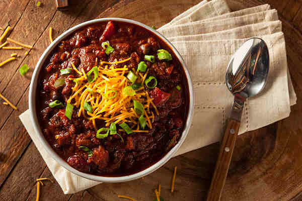Easy Keto Chili Recipe for a Hearty, Low-Carb Meal 3 Homemade vegetarian chili topped with cheese and chopped green onions