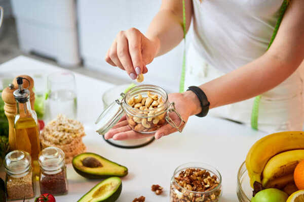 10 Quick and Easy Snacks With No Carbs to Curb Hunger 15 Making a low-carb snack mix of nuts and fruits