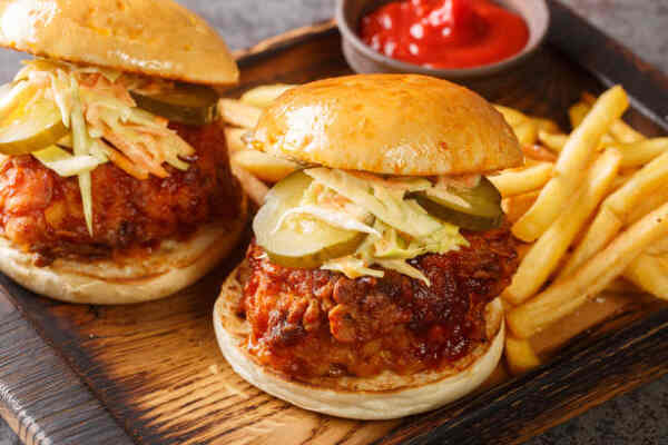 Easy Nashville Hot Chicken Sandwich Recipe You’ll Love 6 Nashville chicken sandwiches with pickles and coleslaw served with fries