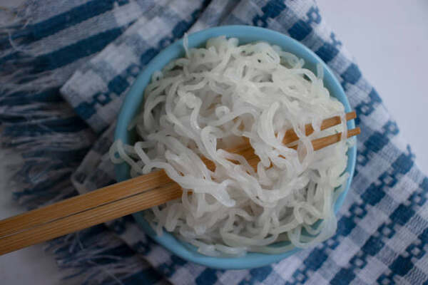 Keto Ramen Recipe: Quick, Tasty, and Low-Carb Friendly 3 Cooked shirataki noodles in a bowl with chopsticks