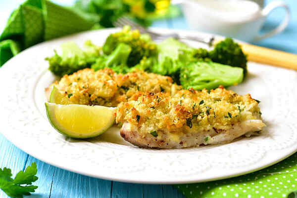 Easy Parmesan Crusted Cod Recipe for a Flavorful Meal 9 Baked breaded cod and broccoli served with lime wedges
