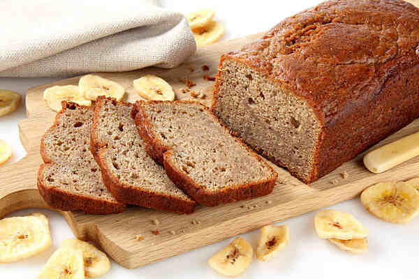 Keto Banana Bread Recipe: Moist, Fluffy, and Low-Carb 9 Homemade banana loaf with sliced bananas