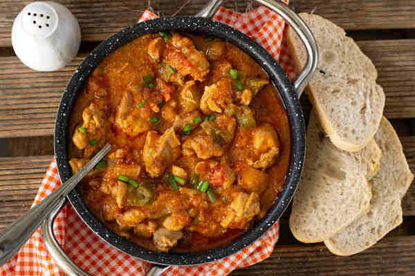 Easy Chicken Paprika in Crock Pot for a Cozy Dinner 5 Traditional chicken paprikash served with slices of bread