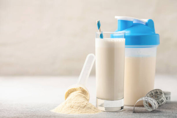 How to Mix Protein Powder Like a Pro: Ultimate Guide 2 Protein shake in a glass and shaker bottle