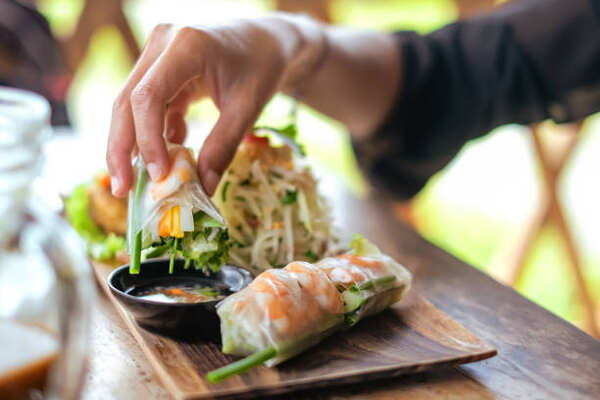 Keto Spring Rolls with Peanut Sauce You’ll Crave Daily 7 Dipping shrimp spring rolls in a sauce