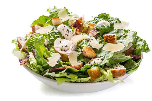 Keto Caesar Dressing That's Creamy, Tangy, and Easy 2 Traditional Caesar salad with dressing and croutons