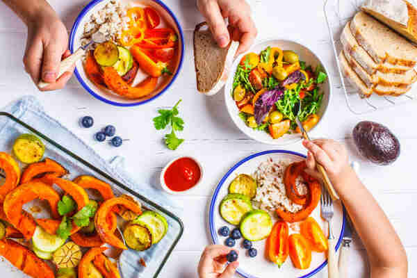 Keto for Picky Eaters: Family-Friendly Meal Ideas 2 A parent and child eating a healthy breakfast with vegetables