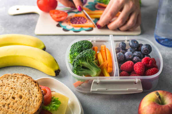 Keto for Picky Eaters: Family-Friendly Meal Ideas 13 Packing lunch with vegetables and fruits