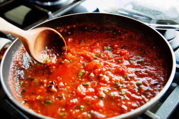 Easy Low-Carb Spaghetti Sauce Recipe for Keto Lovers 6 Making tomato sauce in a pan