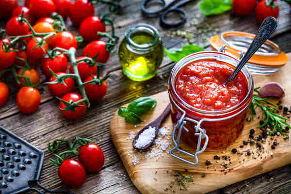 Easy Low-Carb Spaghetti Sauce Recipe for Keto Lovers 5 Homemade tomato sauce in a jar with fresh tomatoes, salt, pepper, and herbs
