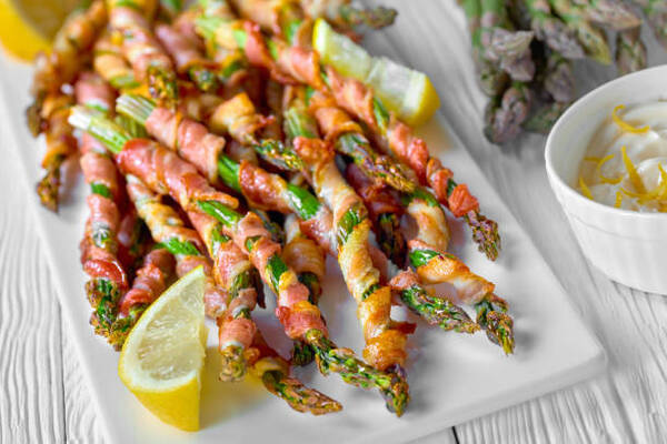10 Low-Carb BBQ Sides Perfect for Your Next Grill Party 5 Baked bacon-wrapped asparagus with lemon and sour cream sauce