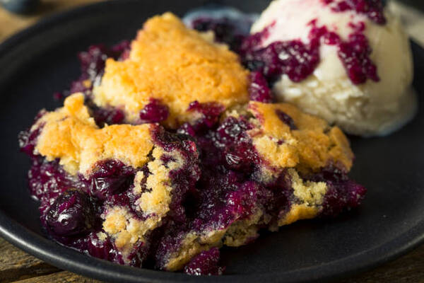 Delicious Keto Dump Cake Recipe for Dessert Lovers 7 Homemade blueberry cobbler served with ice cream
