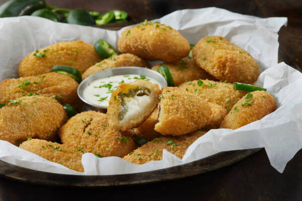 Easy Keto Jalapeno Poppers Recipe for a Spicy Snack 8 Crispy fried breaded jalapeno poppers with sour cream dip