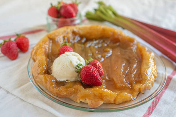 Delicious Keto Dump Cake Recipe for Dessert Lovers 3 Strawberry and rhubarb upside down cake served with a scoop of ice cream