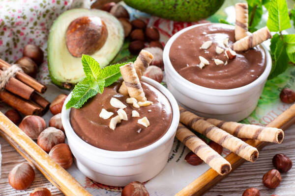10 Keto Dessert Recipes Easy Enough for Beginners 10 Raw avocado chocolate mousse topped with chocolate wafer and mint